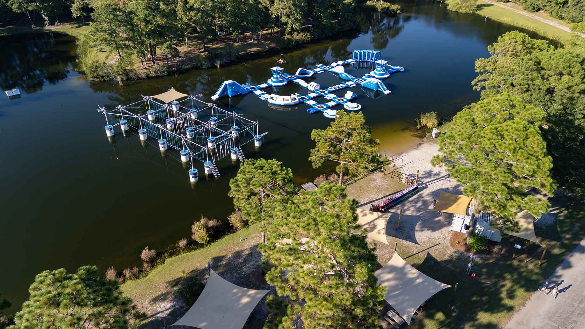 Charleston Aqua Park Summer Camp activities showing kids enjoying water sports and adventures